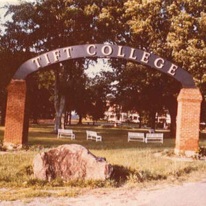 Steel and brick arch entrance with the words Tift College across